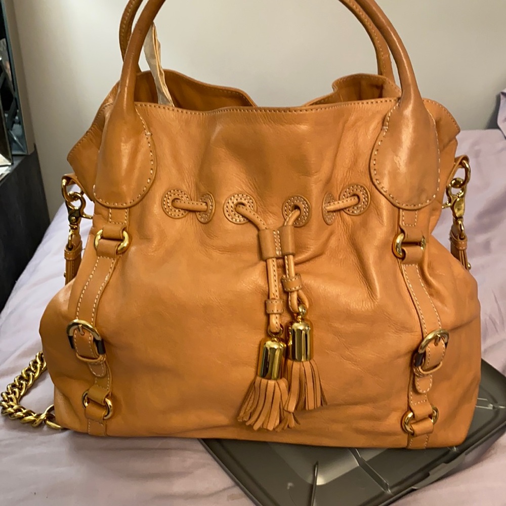 All leather tan bag with tassels and gold chains